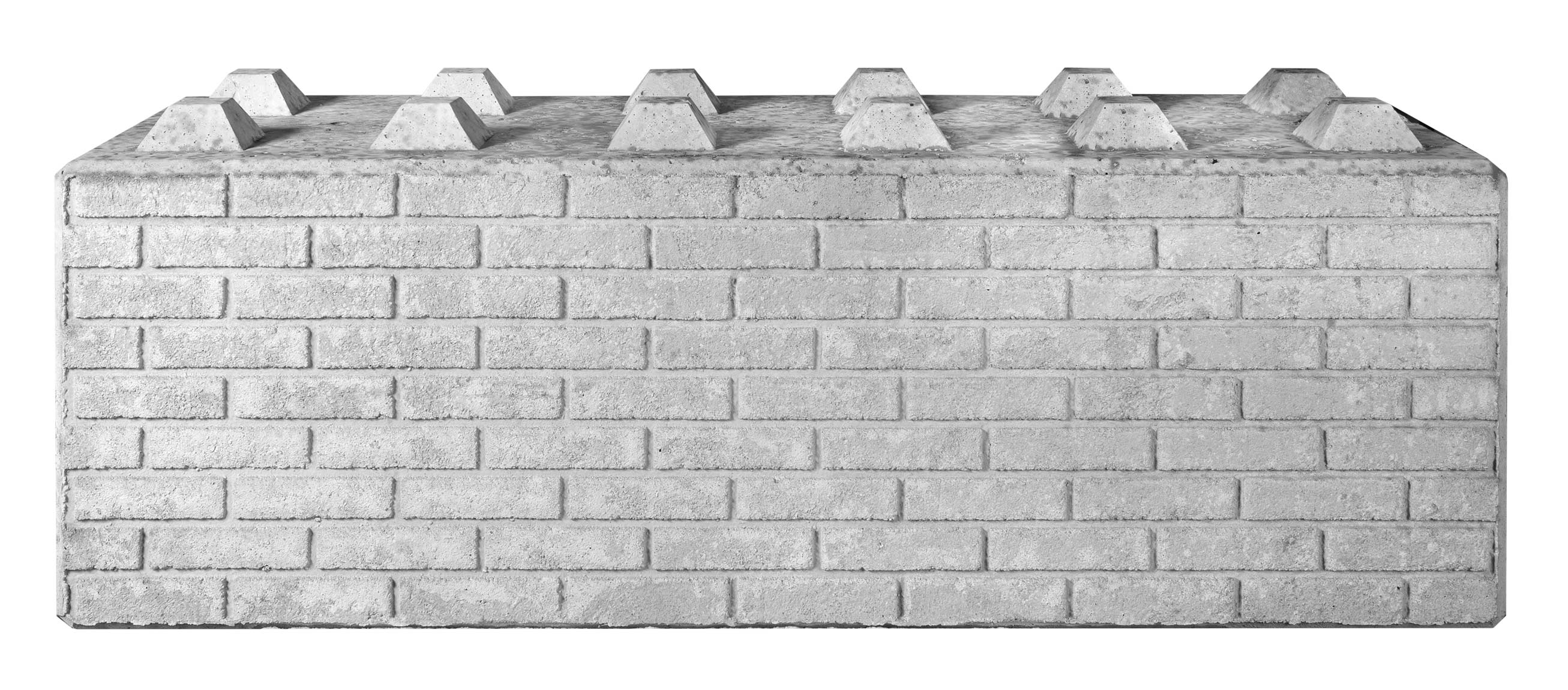 Betonový blok se zuby a s otiskem vzor: cihla